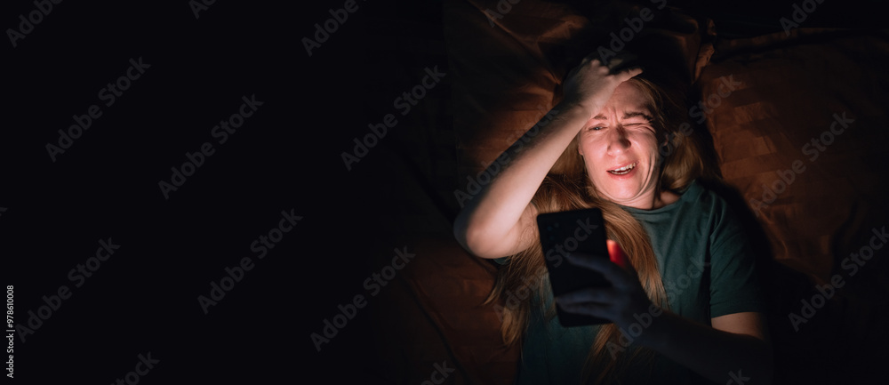 Woman in bed at night using mobile phone suffers from insomnia headaches and mobile addiction Woman in bed at night using mobile phone suffers from insomnia headaches and mobile addiction