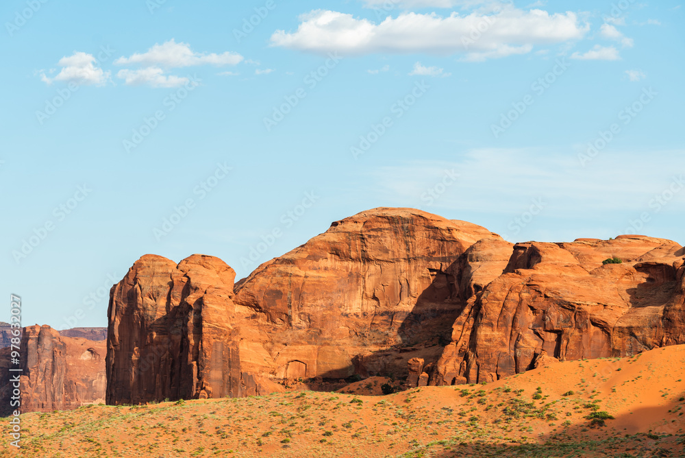 Fototapeta premium Sunlit sandstone rock formations in Monument Valley