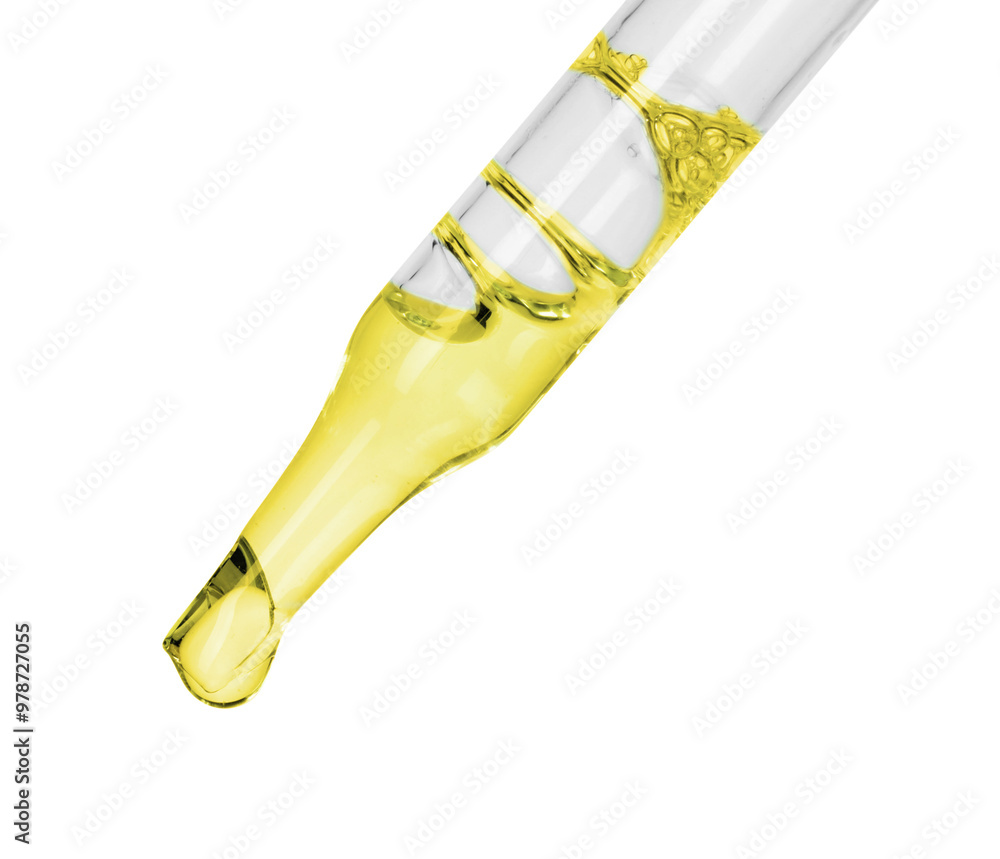 Fototapeta premium Dripping essential oil from pipette on white background