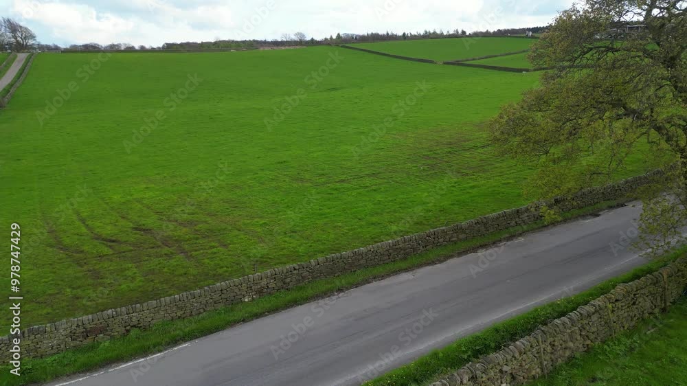 High Angle View of British Agricultural Farms at Countryside and Beautiful Landscape of Near Hills of Rotherham, England Great Britain of UK. April 30th, 2024 High Angle View of British Agricultural Farms at Countryside and Beautiful Landscape of Near Hills of Rotherham, England Great Britain of UK. April 30th, 2024