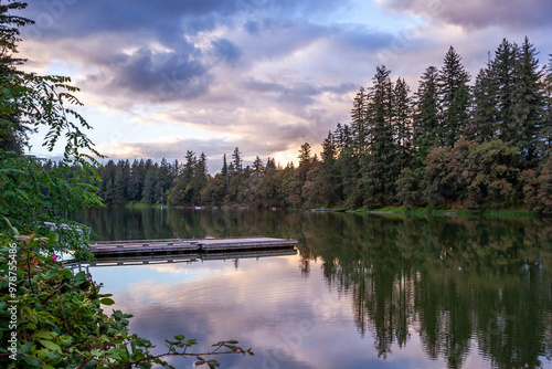 Beautiful reflection of dramatic sunset sky in The Lacamas Lake in Camas, Washington