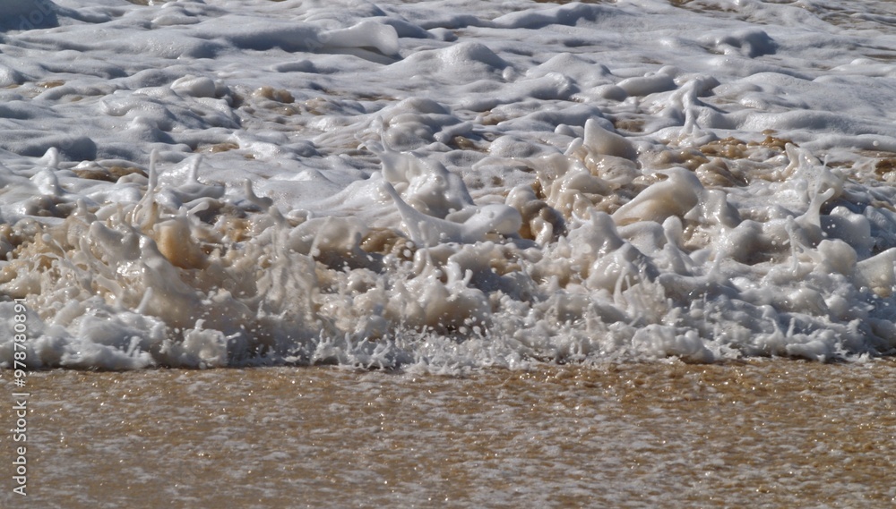 Small waves on the sandy beach Small waves on the sandy beach