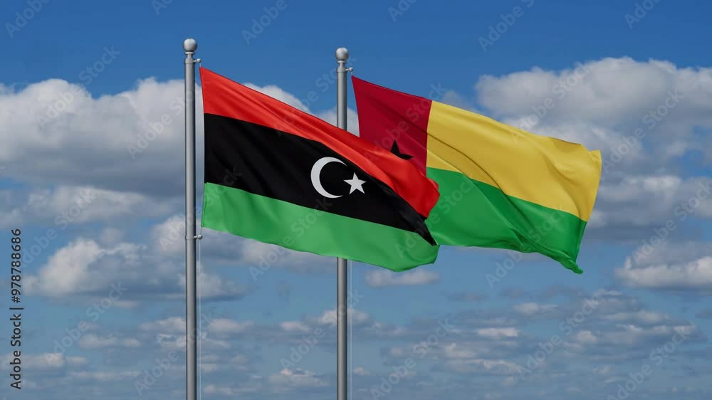 Guinea-Bissau and Libya flags flying together, video concept of the relationship, two country relations concept Guinea-Bissau and Libya flags flying together, video concept of the relationship, two country relations concept