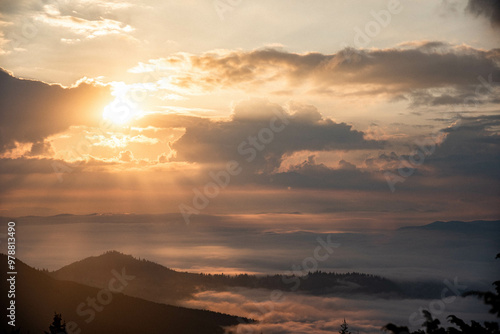 Wallpaper Mural Majestic Mountain Landscape Covered in Mist with Sun Rays Breaking Through Clouds Torontodigital.ca
