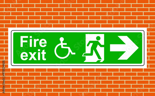 Fire exit wheelchair access right sign on the wall