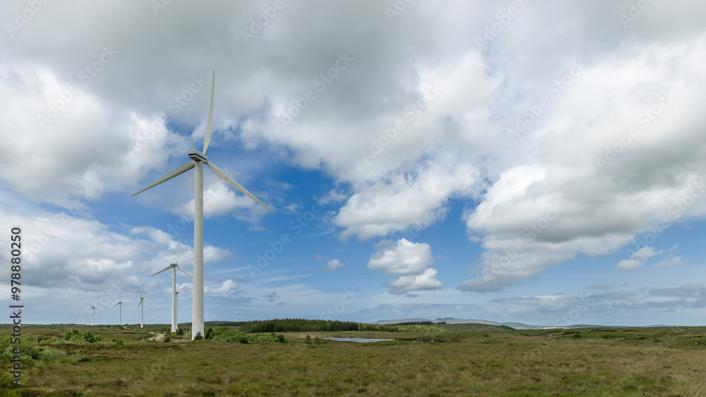 Expansive fields and wind turbines under a textured sky in Ireland, captured in a wide-angle panorama, highlighting renewable energy Expansive fields and wind turbines under a textured sky in Ireland, captured in a wide-angle panorama, highlighting renewable energy