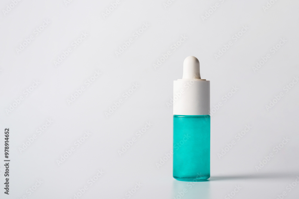 Blue glass cosmetic bottle, Skin care or sunscreen cosmetic on white background. Blue glass cosmetic bottle, Skin care or sunscreen cosmetic on white background.