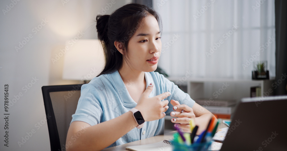 Portrait of Female freelancer having video call meeting with team and presenting project with laptop in home office. Work from home ,Remote work Portrait of Female freelancer having video call meeting with team and presenting project with laptop in home office. Work from home ,Remote work
