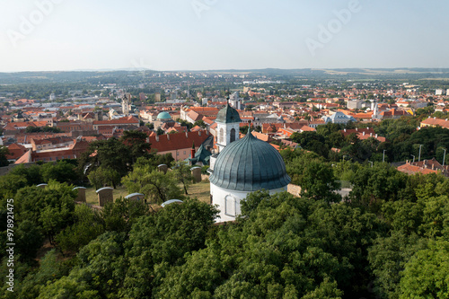 Aerial view of picturesque cityscape with domed roofs and greenery, Pecs, Hungary. photo