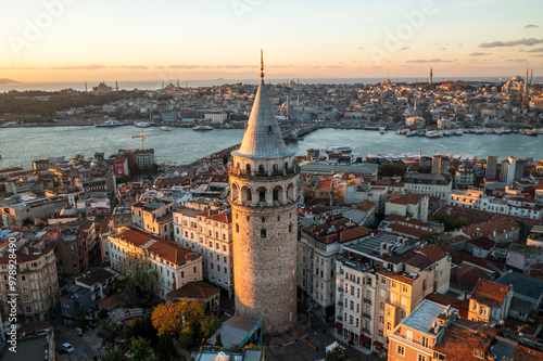 Aerial view of beautiful cityscape with Galata Tower and Bosphorus Strait at sunset, Beyoglu, Turkiye. photo