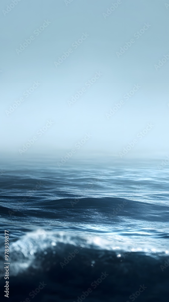 A serene seascape with gentle waves and a misty horizon. A serene seascape with gentle waves and a misty horizon.