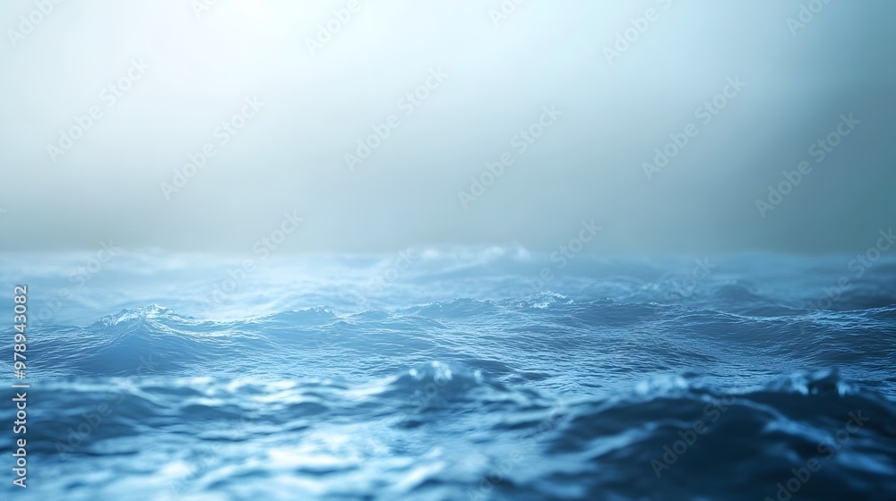 A serene view of calm ocean waves under a misty atmosphere. A serene view of calm ocean waves under a misty atmosphere.