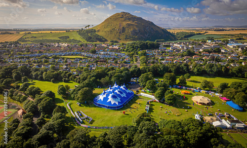 Aerial view of fringe by the sea festival with colorful tents and lush greenery, North Berwick, United Kingdom. photo