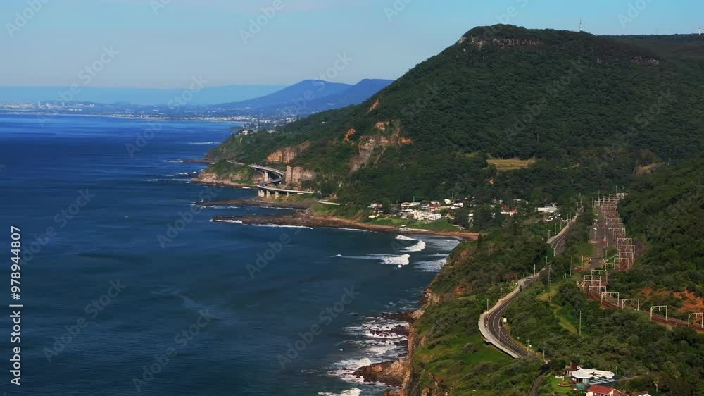 Sunny blue sky morning daytime Sea Cliff Bridge Stanwell Park Beach Tops Bald Hill tele aerial drone Wollongong NSW Australia Sydney South Coast Illawarra Coalcliff Throull train circle right slow Sunny blue sky morning daytime Sea Cliff Bridge Stanwell Park Beach Tops Bald Hill tele aerial drone Wollongong NSW Australia Sydney South Coast Illawarra Coalcliff Throull train circle right slow