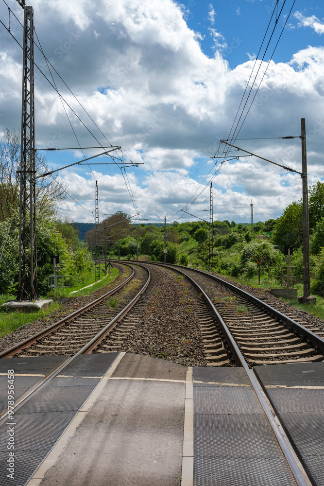 Railway outdoors on beautiful summer day. Industrial landscape with rails and railway.