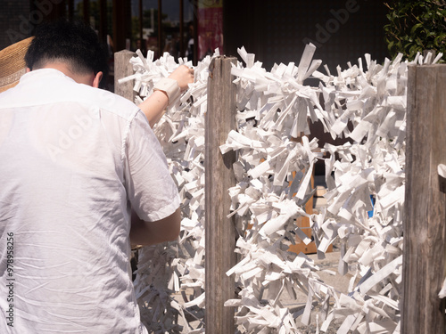 a man in a shirt holding a basket