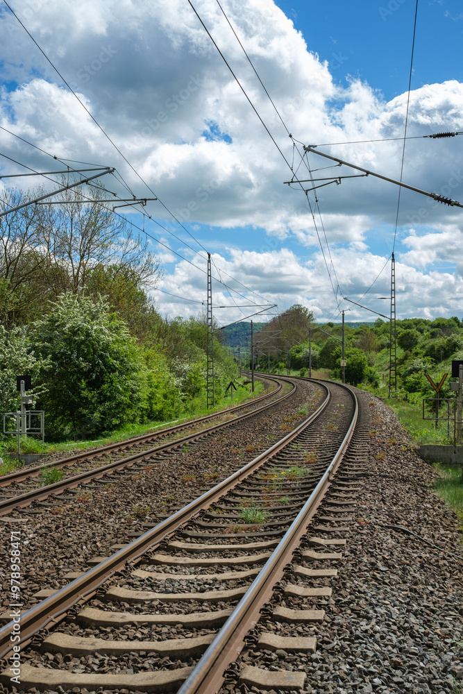Railway outdoors on beautiful summer day. Industrial landscape with rails and railway.