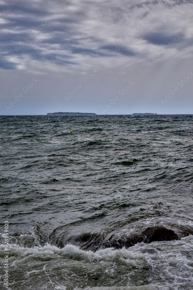 Cannes, France - September 7th 2024 : View of the Mediterranean Sea from the beach. The sea is restless, there are many waves. Cannes, France - September 7th 2024 : View of the Mediterranean Sea from the beach. The sea is restless, there are many waves.