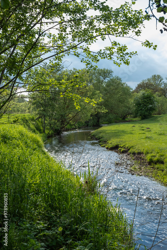 Obraz na płótnie Stormy stream on the mountain river on a sunny day. Close up shot. w salonie