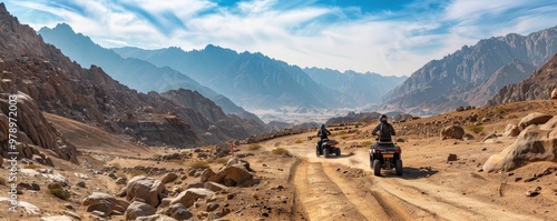 Adventurous traveler on an ATV rides through rugged desert terrain under a vast, panoramic sky. off-road vehicles theme.