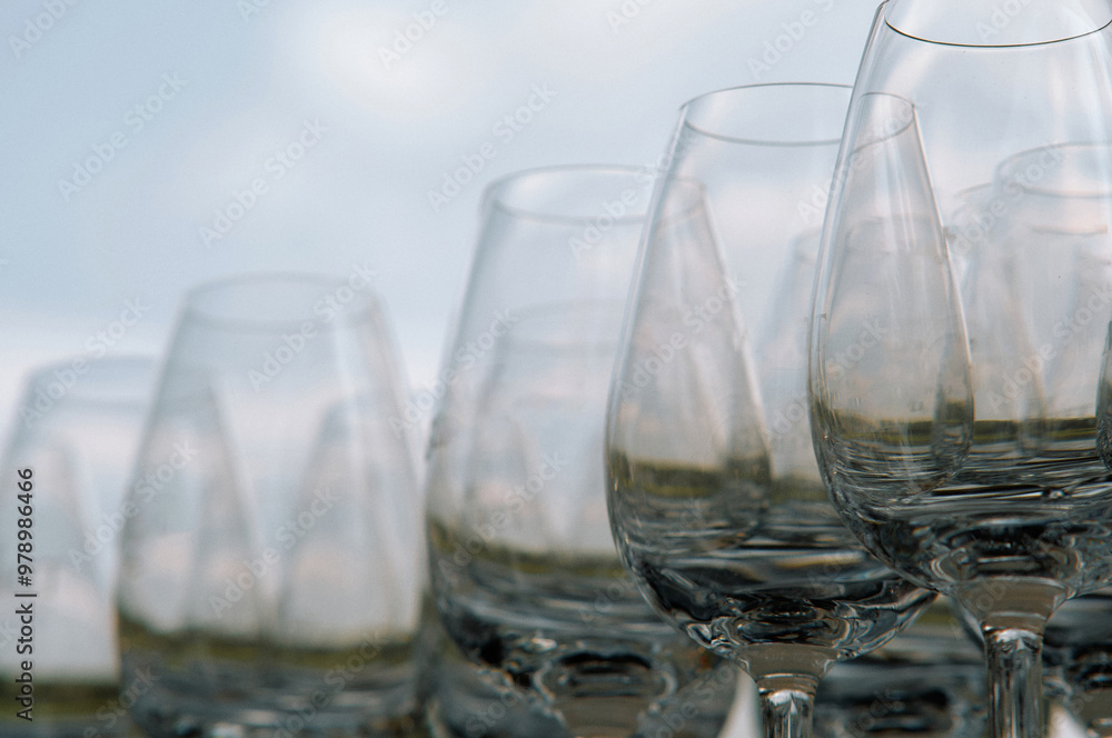 Obraz premium Elegant glassware glasses stacked in stacks captured on a sunny day concept