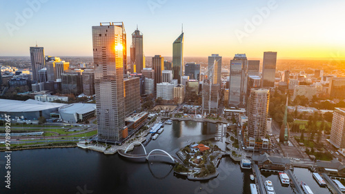Aerial view of elizabeth quay and elizabeth quay bridge with sunset reflection on the swan river, perth, australia.