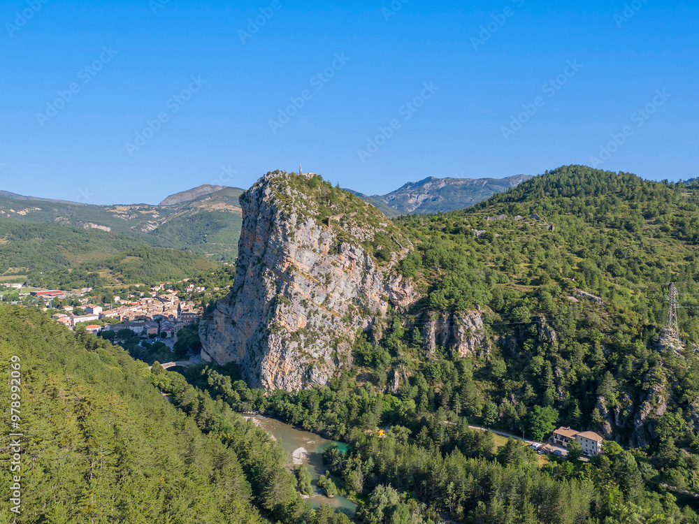 Aerial view of scenic mountain valley with rock formations and a river, Castellane, France. Aerial view of scenic mountain valley with rock formations and a river, Castellane, France.