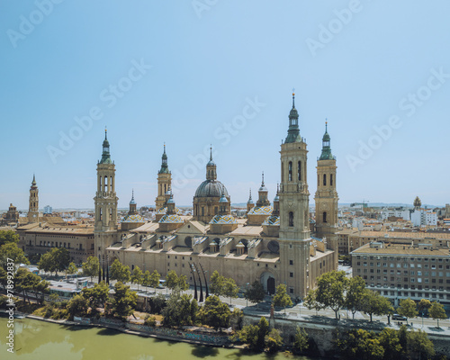 Aerial view of the beautiful Basilica of Our Lady of the Pillar surrounded by a scenic cityscape and river, El Rabal, Zaragoza, Spain. photo