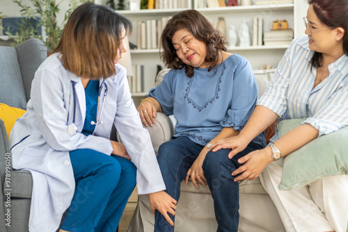 Female healthcare professional providing at home medical care to elderly woman with smile, senior patient, nursing, listens attentively to nurse, elderly care, home health services, patient at home