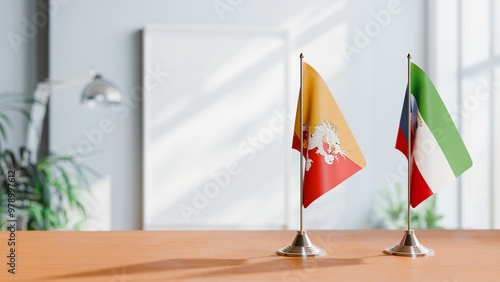 FLAGS OF BHUTAN AND EQUATORIAL GUINEA ON TABLE