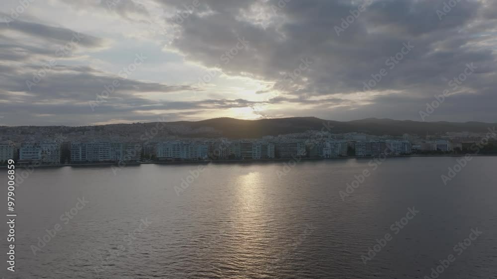 Drone shot of Thessaloniki, Greece at sunrise from a long distance Drone shot of Thessaloniki, Greece at sunrise from a long distance