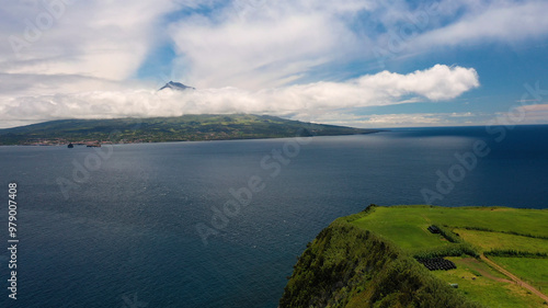 Aerial view of the serene and picturesque island of Faial surrounded by the majestic Atlantic Ocean, Horta, Portugal. photo