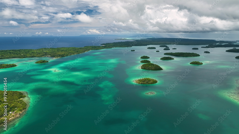 Aerial view of tropical islands with beautiful sandy beaches and vibrant blue ocean, Solomon Islands. Aerial view of tropical islands with beautiful sandy beaches and vibrant blue ocean, Solomon Islands.