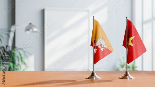 FLAGS OF BHUTAN AND VIETNAM ON TABLE