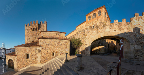 Panoramic view where we can see the Bujaco tower and the Estrella arch, one of the entrances to the historic center, a monumental complex, of the city of Caceres, in Extremadura, Spain. photo