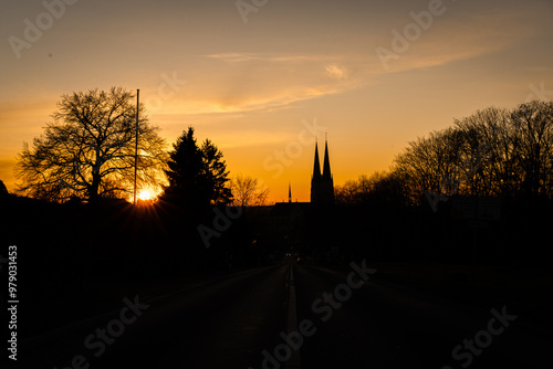 Stadt mit goldenem Himmel bei Sonnenaufgang photo