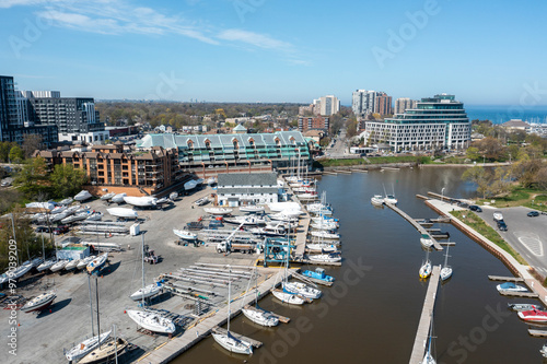 Aerial view of beautiful marina with boats docked and urban skyline, Bronte, Canada.