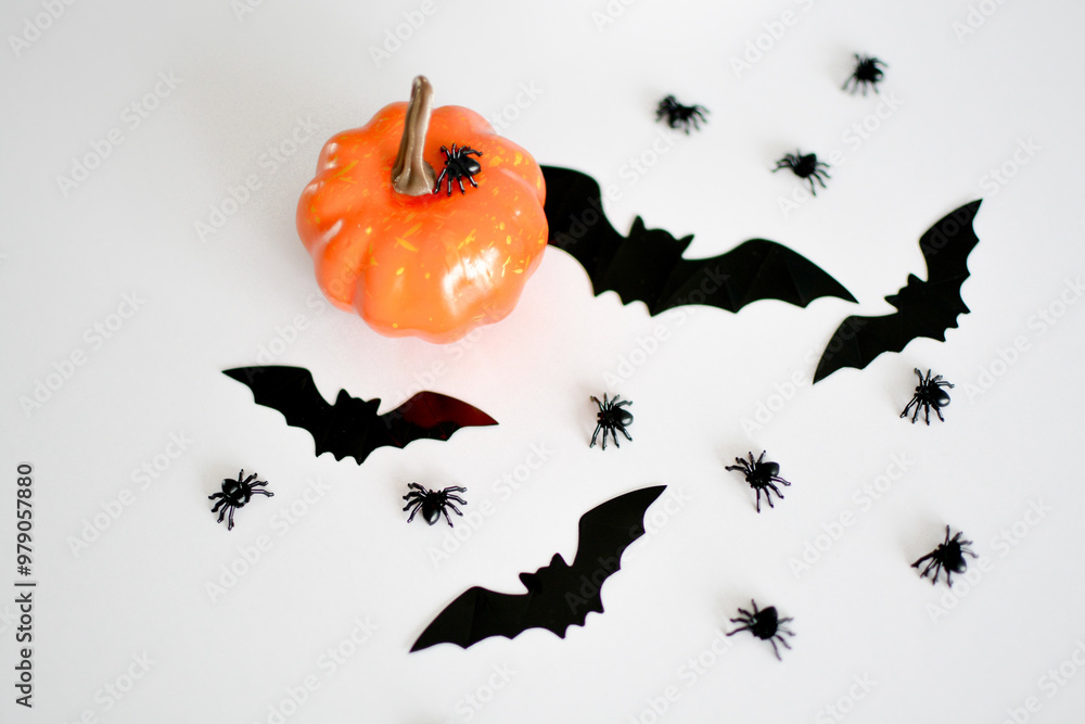 Halloween decorations in the form of pumpkins, spiders and bats on a background white background Halloween decorations in the form of pumpkins, spiders and bats on a background white background