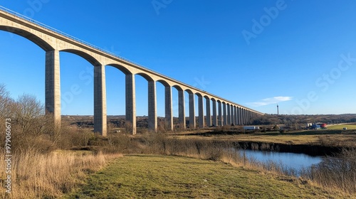 Long Concrete Bridge Over River with Blue Sky