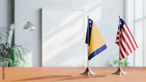 FLAGS OF BOSNIA AND LIBERIA ON TABLE photo