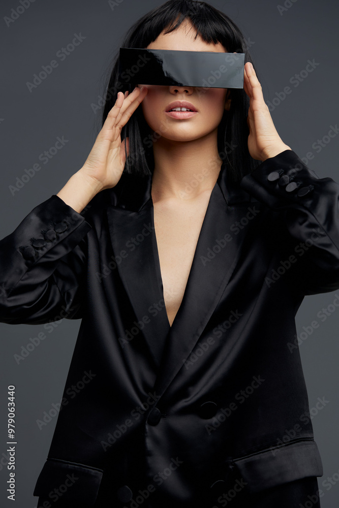 Virtual reality glasseswearing woman in a black suit, looking directly at the camera, embodying a futuristic, techsavvy professional appearance Virtual reality glasseswearing woman in a black suit, looking directly at the camera, embodying a futuristic, techsavvy professional appearance