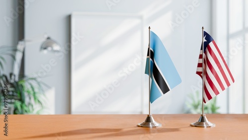 FLAGS OF BOTSWANA AND LIBERIA ON TABLE photo