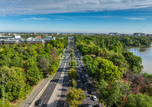 Drone aerial landscape over Bucharest. Kiseleff boulevard during rush hour traffic, Arch of Triumph and other landmarks in Bucharest, Romania, during a beautiful sunny day. photo