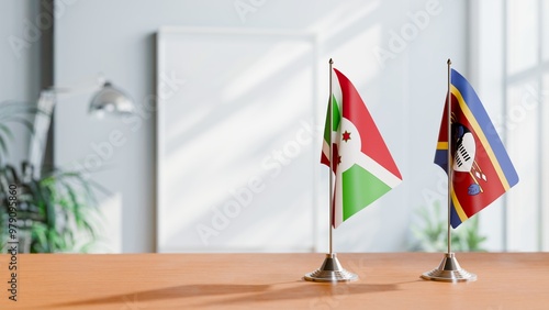 FLAGS OF BURUNDI AND SWAZILAND ON TABLE