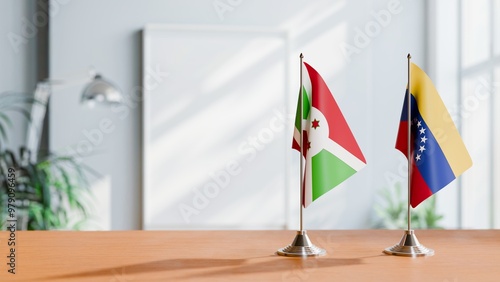 FLAGS OF BURUNDI AND VENEZUELA ON TABLE