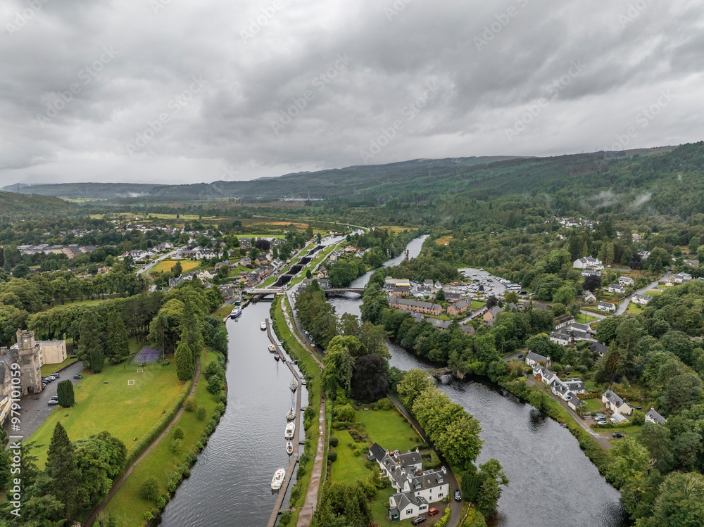 Aerial view of Loch Ness surrounded by lush greenery and a quaint village, Fort Augustus, Scotland. Aerial view of Loch Ness surrounded by lush greenery and a quaint village, Fort Augustus, Scotland.