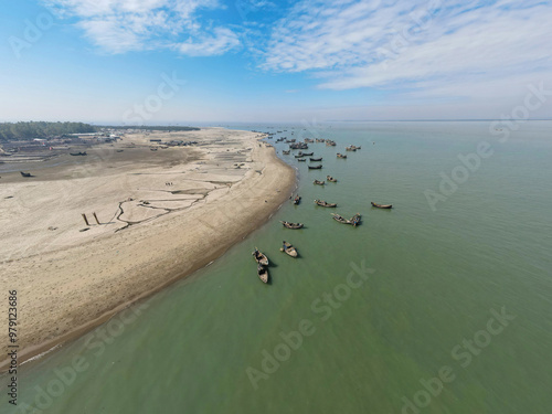 Aerial view of fishing boats at fishery ghat along the coastline of Bay of Bengal, Cox Bazar, Bangladesh.