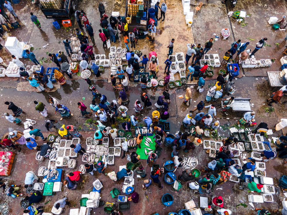 Aerial view of bustling fishery market with vibrant vendors and buyers, Chittagong, Bangladesh. Aerial view of bustling fishery market with vibrant vendors and buyers, Chittagong, Bangladesh.