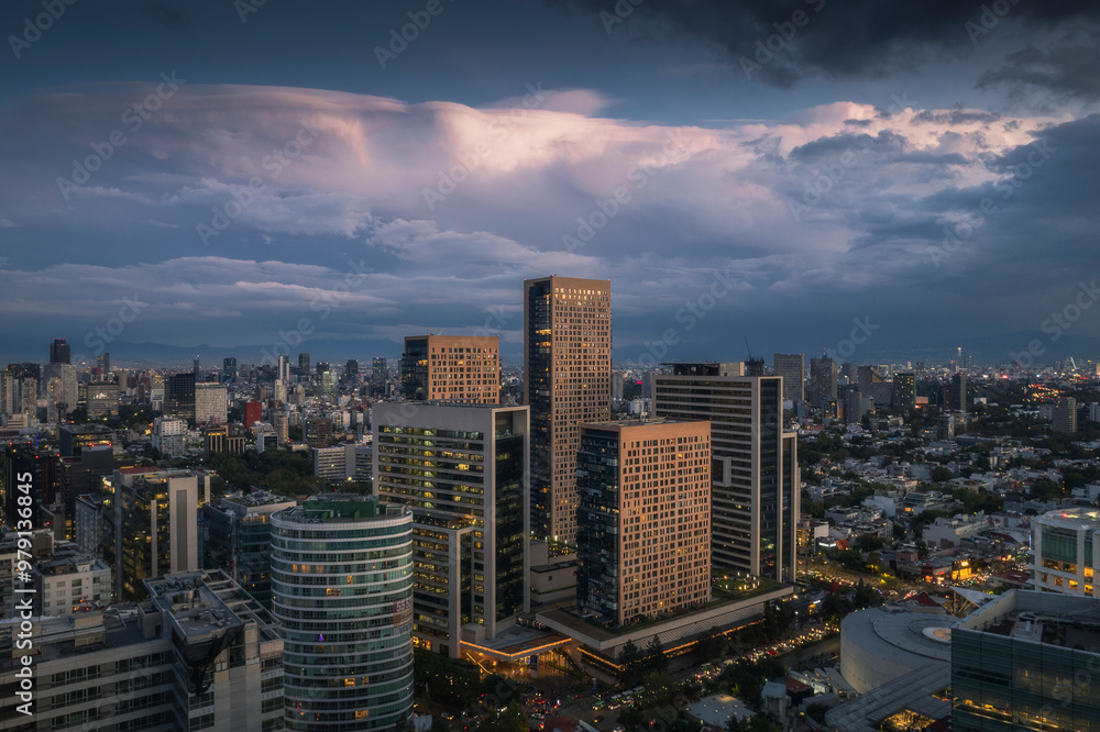 Aerial view of miyana tower and cityscape at sunset with beautiful clouds, Miguel Hidalgo, Mexico. Aerial view of miyana tower and cityscape at sunset with beautiful clouds, Miguel Hidalgo, Mexico.