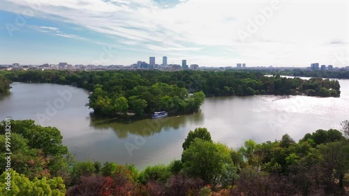 Northern part of Bucharest from above. Aerial cityscape 4k video with Bucharest, Romania, next to Arch of Triumph, Herastrau Lake and Free Press Square (Piata Presei Libere in Romanian). Visit Romania photo